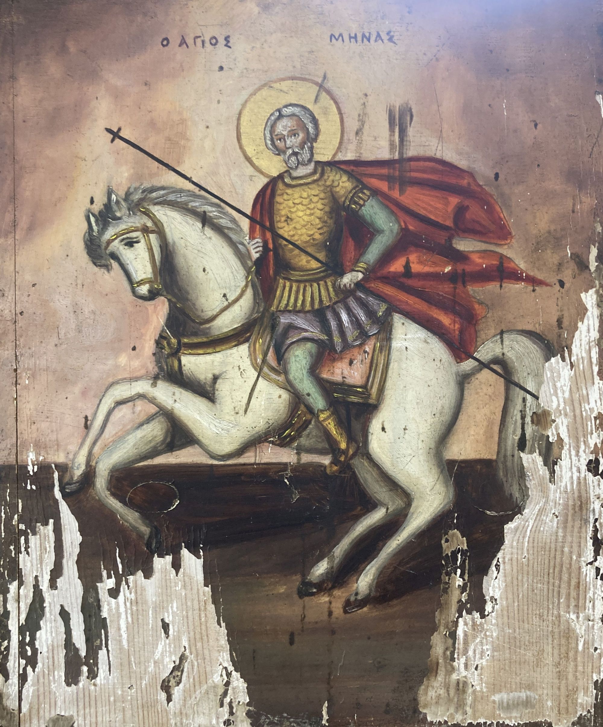 Eastern European School, tempera on panel, Icon of St Minas on horseback, 36 x 29.5cm and a small work on parchment, signed Joan